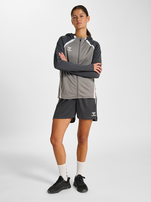 hmlLEAD 2.0 ZIP HOODIE WOMAN, STEEL GRAY/ASPHALT, model