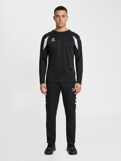 hmlCORE 2.0 WOVEN PANTS, BLACK/WHITE, model